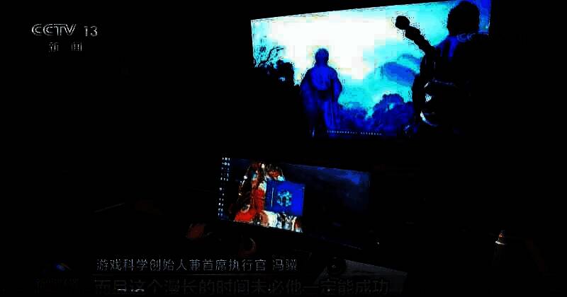 《黑神话》制作人冯骥出现在新闻联播画面